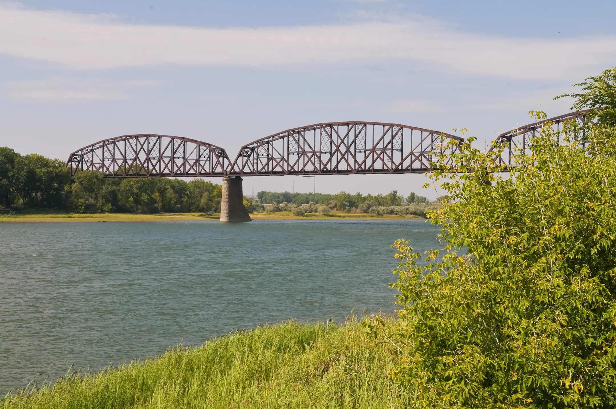Historic bridge over calm river
