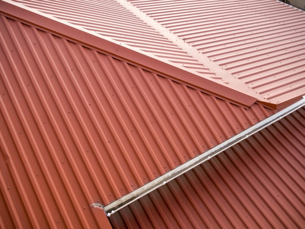 Roof of the house with metal corrugated panels
