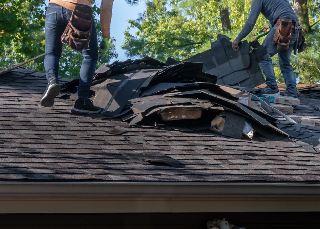tearing off old roofing