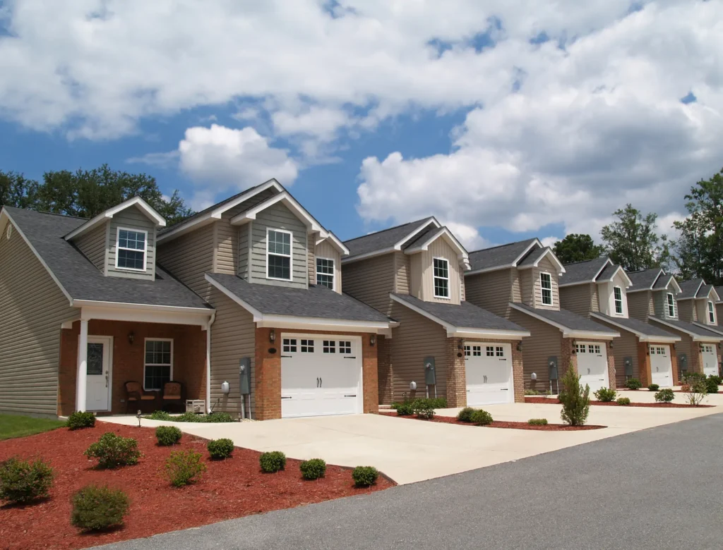 sloped roof multiple small houses with garage and windows