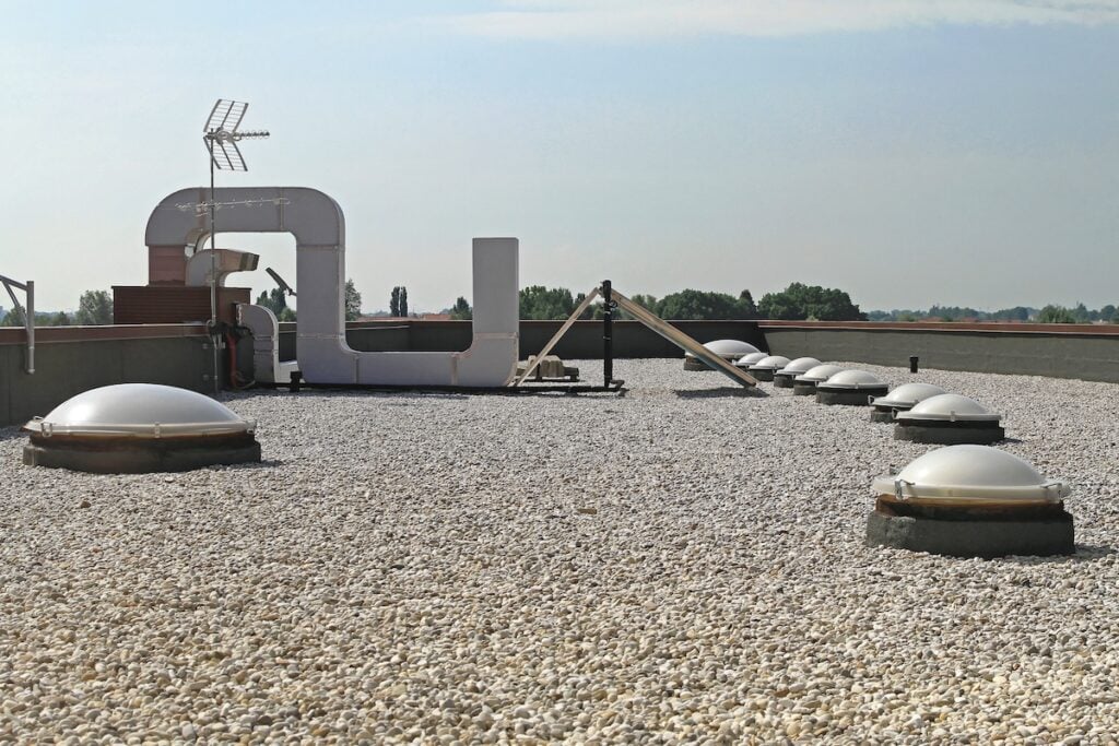Flat Roof With Gravel and Skylight Windows