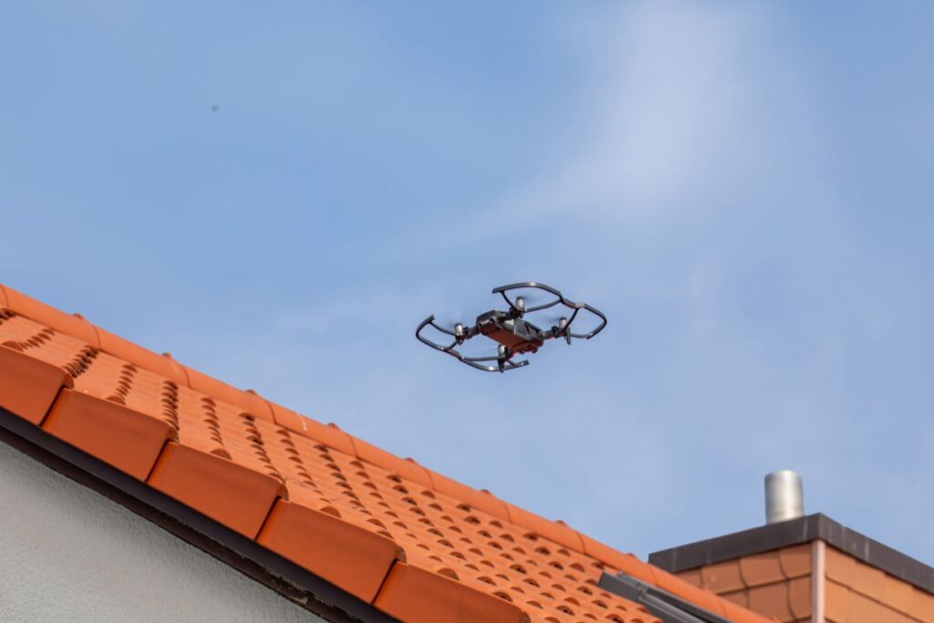 roof inspection services drone on top of tiles roof