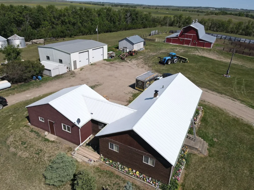 standing seam metal roof white and red house