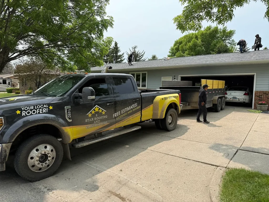 signs of hail damage on roof five stars truck parked outside house