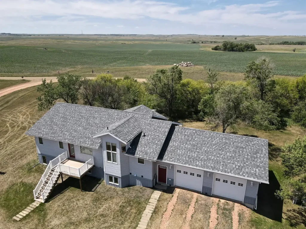 roof water damage aerial view big white an grey house in country side