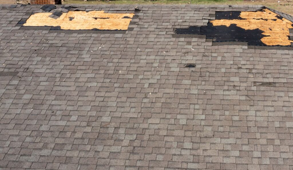 roof water damage aerial view shingles missing