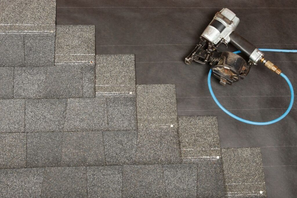 A shingle roof being installed