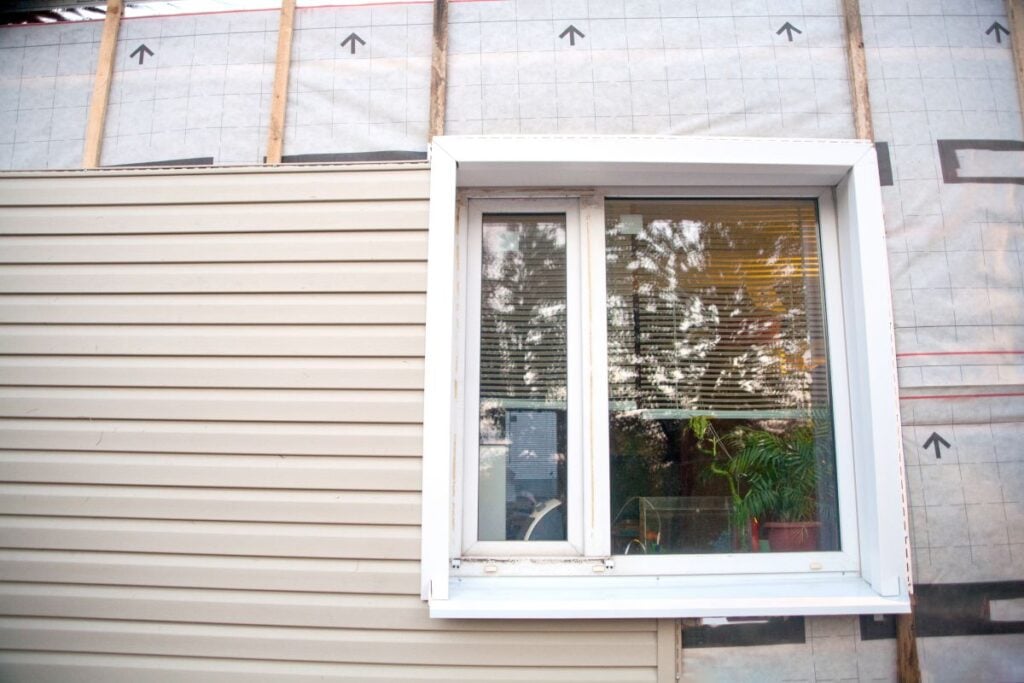 Siding being installed on a house